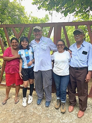 From left, Ian Diamondstone’s neighbor Francesca, Maritza’s granddaughter, Diamondstone, Maritza, and Rigoberto in front of the gate to his home in Nicaragua.