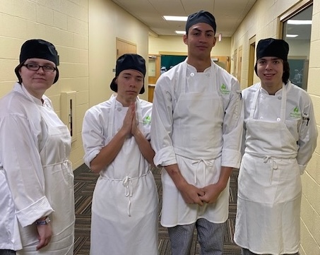 Left to right: Windham Regional Career Center students Orión Knowlton, Blaize Weiss, Quin Forchion, and T Contakos at the Culinary Institute of America moments before starting the competition.