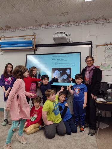 Rep. Michelle Bos-Lun with students at Windham Elementary School as they consider options for the Vermont State Mushroom.