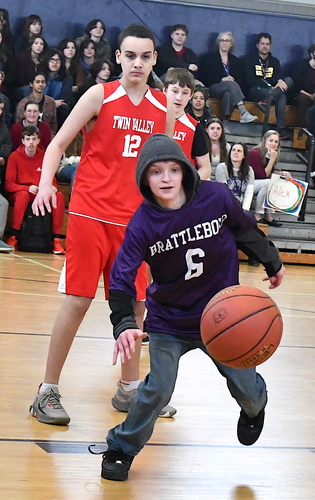Brattleboro’s Caden Russell (6) chases down a loose ball as Twin Valley’s Nathaniel Hernandez (12) looks on during the first half of their Unified basketball game on April 5 in the BUHS gym.