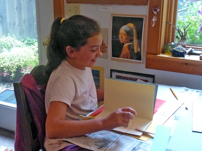 Leah Sutton-Smith works on her book at The Poetry Studio.