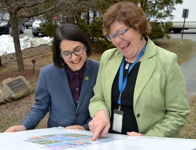 U.S. Rep. Becca Balint, left, and Andrea Seaton, Senior Director of Development, Marketing & Community Relations for Grace Cottage Family Health & Hospital in Townshend, look at the plans for a $20 million expansion of Grace Cottage’s primary care clinic during an April 1 news conference.