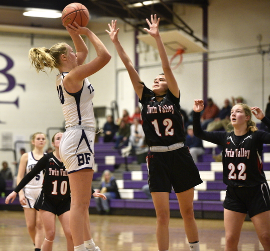 Twin Valley defenders Alanna Bevilacqua (12) and Kate Oyer (22) attempt stop Bellows Falls forward Laura Kamel as she drives toward the basket during their Dec. 15 game at Holland Gymnasium. Bevilacqua and Oyer led Twin Valley to a pair of wins to close out the regular season.