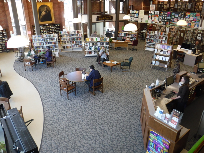The main room of Brooks Memorial Library, a public resource that welcomes all &mdash; and one that its director, Starr LaTronica, is finding is playing an increasing role in the well-being of patrons who have no place to live.