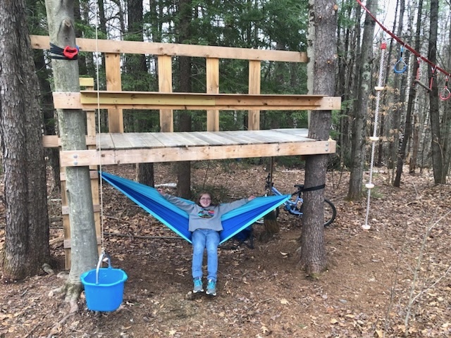 Maddy Sprague of Putney, 13, relaxes on the hammock she added to her self-made tree house. Sprague will be attending Rosie’s Girls Camp this summer at HatchSpace where she hopes to learn more about power tools and construction.