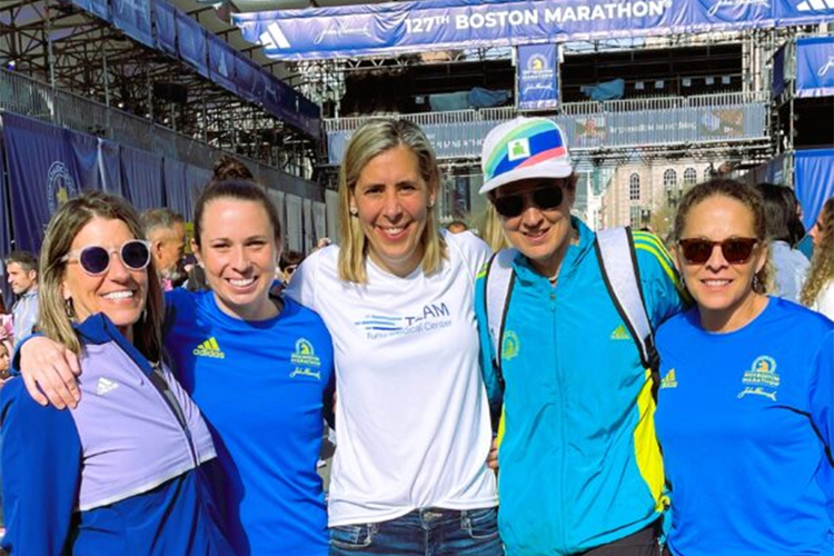 Nicole James visits the Boston Marathon finish line over the weekend with fellow Brattleboro-area runners (from left) Lois Sparks, Halie Lange, Nicole James, Elizabeth Bianchi, and Maxine Stent. 