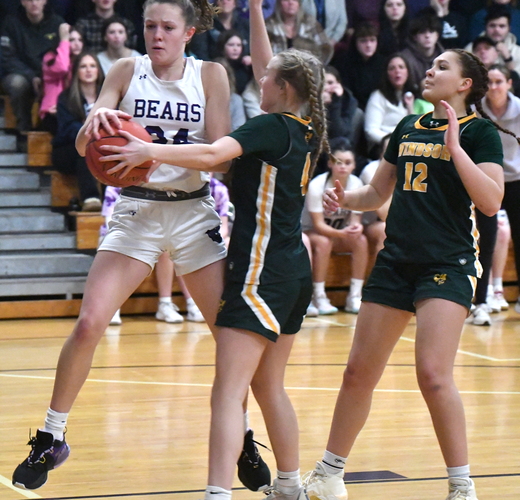 Brattleboro’s Montana Frehsee (24) pulls down a rebound in front of Windsor defenders Audrey Rupp, center, and Sophia Rockwood, right, during the second half of their game on Feb. 9 at the BUHS gym.