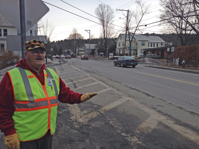 In this 2013 photo, Brattleboro crossing guard Dave Wheelock talks about pedestrian safety at the intersection of Union Street, Cedar Street, and Western Avenue.