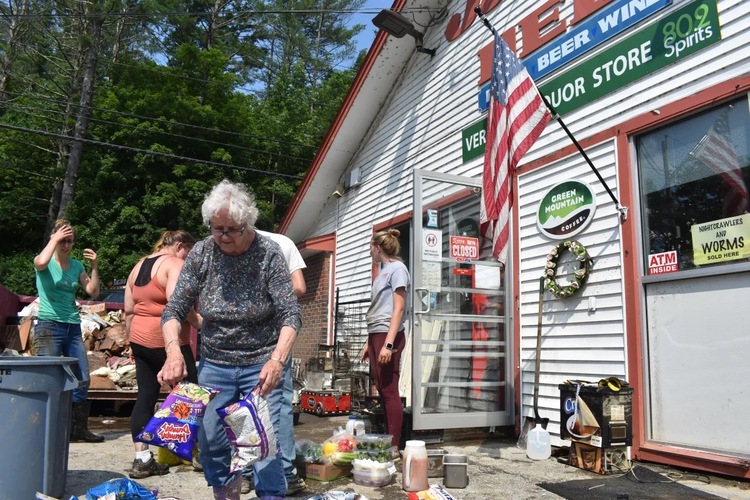   Beverly Jelley and volunteers clean out her store in Londonderry on Tuesday, July 11.
