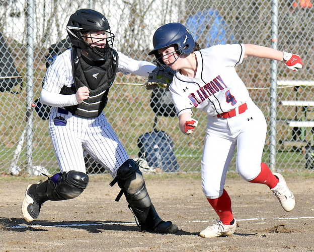 Brattleboro catcher Kayli Speno tags out Mount Anthony baserunner Eva Cross after she was caught in a rundown in the first inning of their April 15 softball game at Sawyer Field.