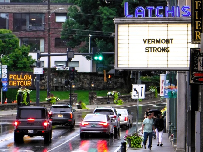 The marquee of downtown Brattleboro’s Latchis building offers a message for a state hard-hit by summer storms.