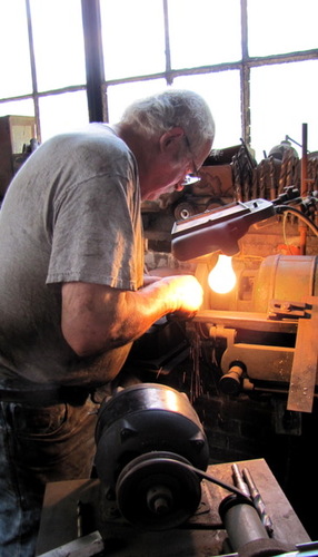 Lester Dunklee hard at work at the R.E. Dunklee and Sons Machine Shop on Flat Street in Brattleboro. After a century of operation, it will be shutting its doors at the end of the year.