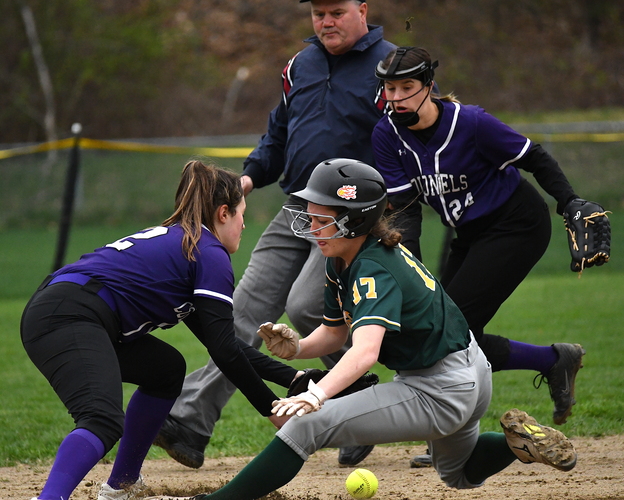Brattleboro shortstop Aliza Speno, left, tries to catch the ball as Burr & Burton baserunner Tela Dykes (17) slides into second base during the first inning of their April 22 softball game. At right, backing up the play, is Brattleboro second baseman Jasmine Thibeault (24).