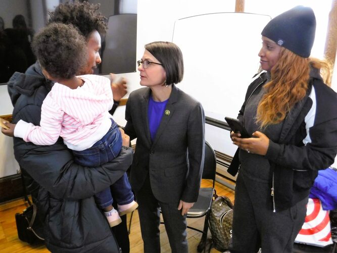 U.S. Rep. Becca Balint talks with a newly resettled refugee family from the African country of Eritrea during a Feb. 13 visit to the Multicultural Community Center of Southern Vermont in Brattleboro.