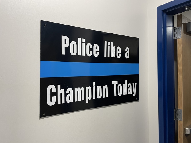 A sign inside the Brattleboro police station encourages patrol officers.