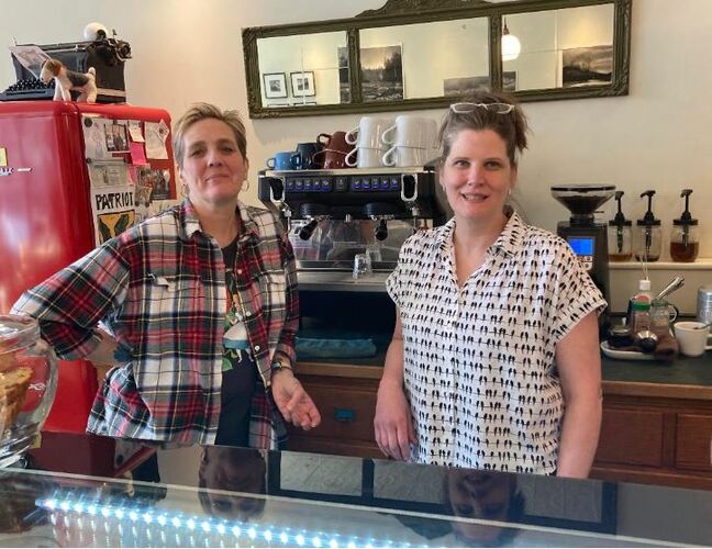 Susan Sheffer, left, and Larisa Demos, worker/owners at the Flat Iron Co-op in Bellows Falls, have created Table 7, a new program to let people who need a cup of coffee or some food to get it &mdash; no questions asked.