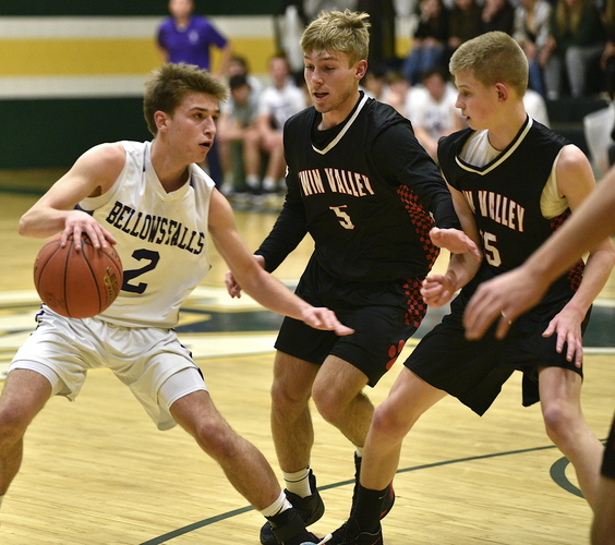 Twin Valley defenders Cody Magnant (5) and Brayden Brown (15) move in on Bellows Falls guard Colby Dearborn (2) during first-half action in the boys’ championship game of the Green Mountain Holiday Tournament on Dec. 14 in Chester.