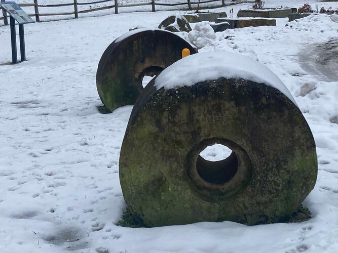 Two large pulp milling stones, salvaged from the Connecticut River, are now part of the park’s displays.