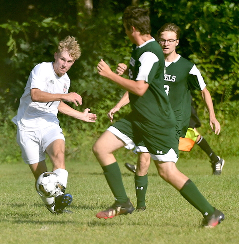 Twin Valley’s Cory Magnant, left, seen here passing the ball past a pair of Leland & Gray defenders in the season opener on Sept. 1, scored three goals against Green Mountain in a 3-1 win for the Wildcats on Sept. 5 in Chester.
