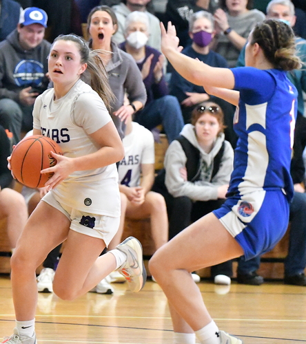 Brattleboro’s Kate Pattison, left, drives past Hartford defender Hailey Vanasse during the second half of their girls’ basketball game on Dec. 30 at the BUHS gym.
