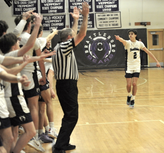 Brattleboro guard Karson Elliott (2) gestures toward his team’s bench as his teammates celebrate his game-winning three-point shot with 7.6 seconds left in regulation to seal a come-from-behind 52-51 win over Burr & Burton on Jan. 26 at the BUHS gym.