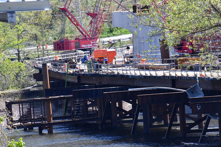 A temporary trestle sits beside one of the completed concrete piers for the new Brattleboro-Hinsdale bridge across the Connecticut River.