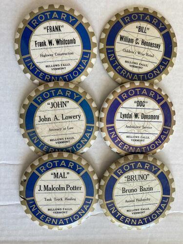 Several historic Rotary ID buttons with the names of many well-known Bellows Falls citizens of past years.