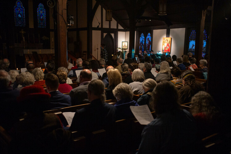 The St. Michael’s community and guests participate in a Taize service for Susan Dedell’s retirement as the church’s music director.