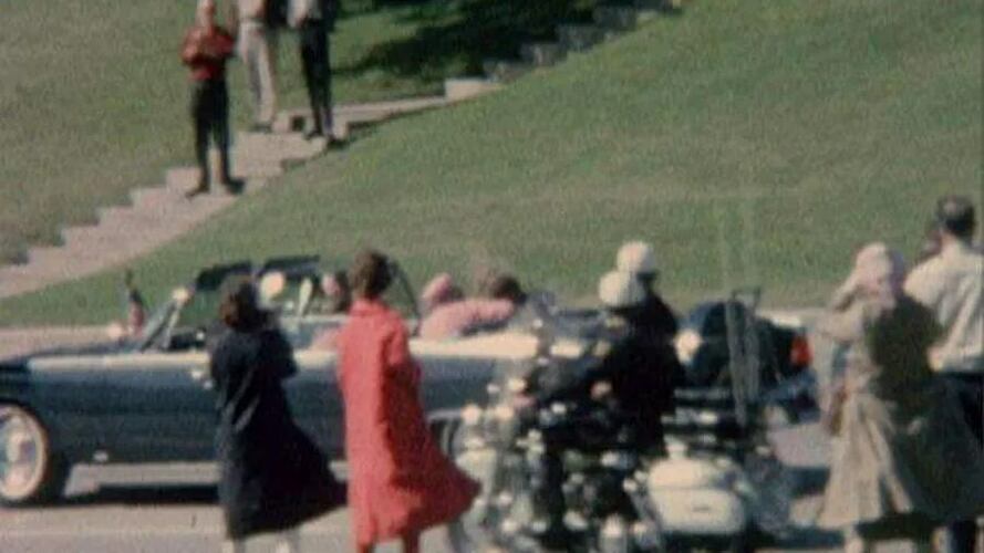 The woman nicknamed “Babushka Lady,” far right, appears in numerous eyewitness photographs and video footage filming the presidential motorcade in Dallas. Since 1970, Beverly Oliver has maintained that she is the mystery woman, and that authorities confiscated her undeveloped film several days after Kennedy’s assassination.