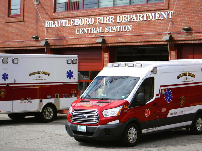 Two Golden Cross ambulances are parked in front of the Central Fire Station on Elliot Street in Brattleboro.